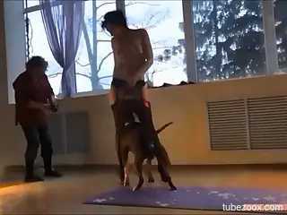 Nude beauty feels the dog in both pussy and ass