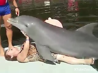 Cuban granny getting humped by a sexy dolphin